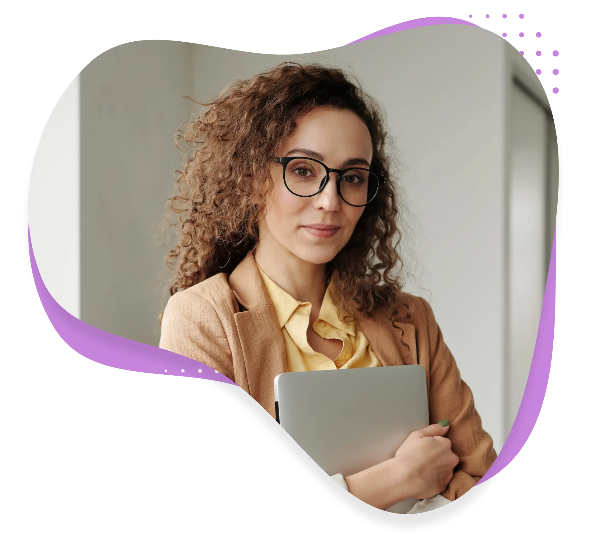 A medical billing specialist with glasses holds a laptop